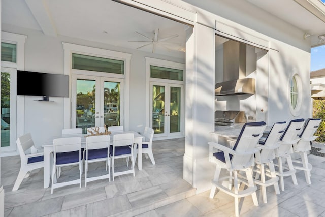 view of patio with french doors and exterior kitchen