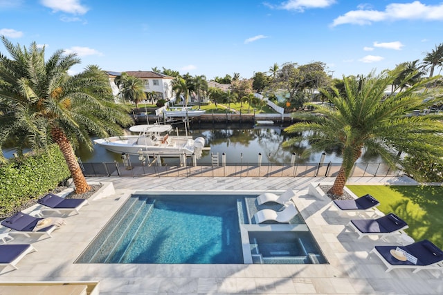 view of pool with a water view, an in ground hot tub, a patio area, and a boat dock