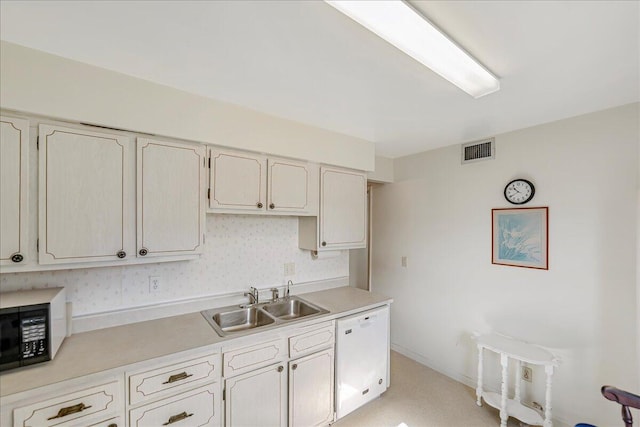 kitchen featuring dishwasher and sink