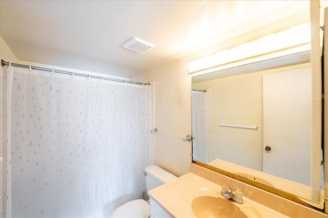 bathroom featuring vanity, toilet, and a shower with shower curtain