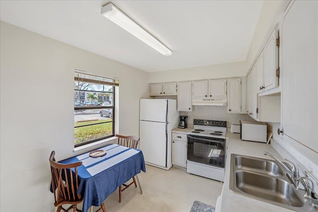 kitchen with sink, backsplash, white cabinets, and white appliances