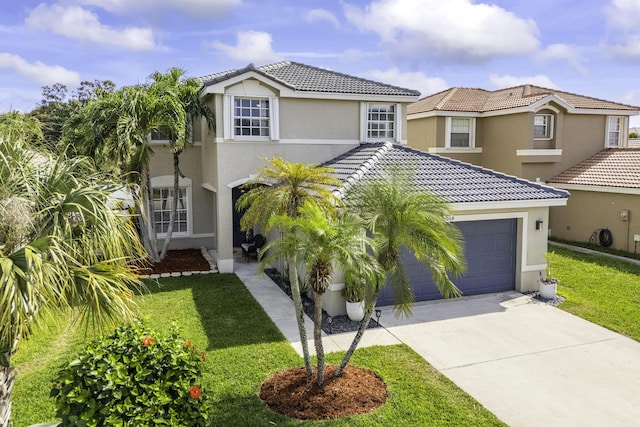 mediterranean / spanish-style home with a garage and a front lawn