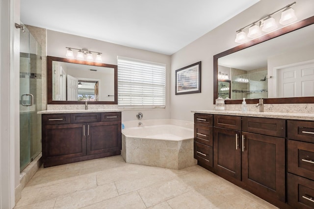 bathroom featuring vanity, shower with separate bathtub, and tile patterned flooring