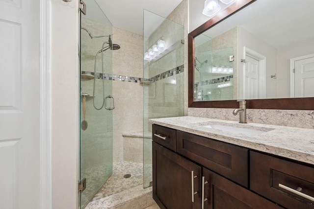 bathroom featuring vanity and walk in shower