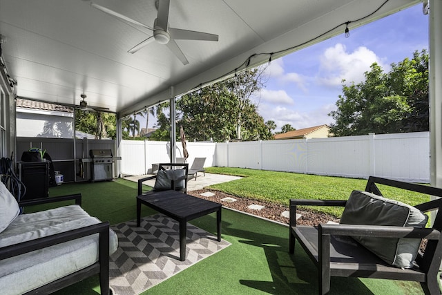 view of patio featuring area for grilling, an outdoor hangout area, and ceiling fan