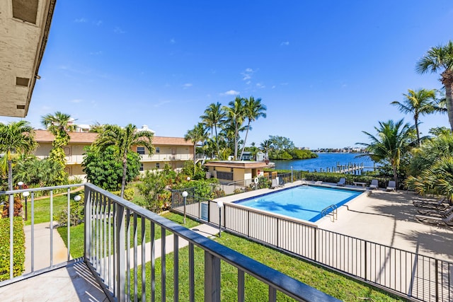 view of pool featuring a water view