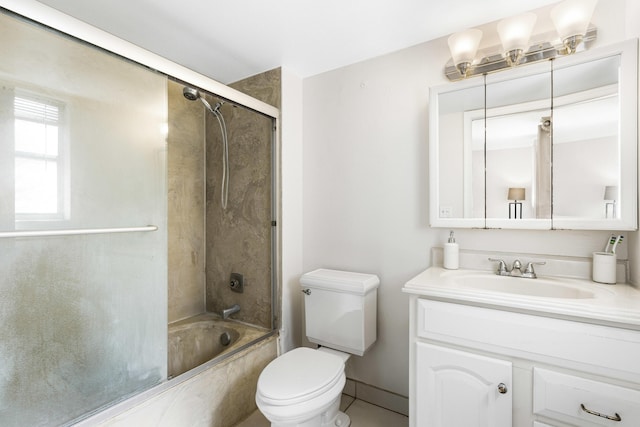 full bathroom featuring toilet, vanity, and shower / bath combination with glass door