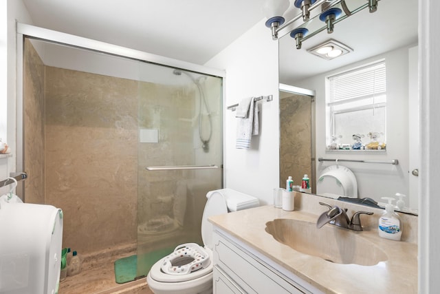 bathroom featuring walk in shower, vanity, and toilet