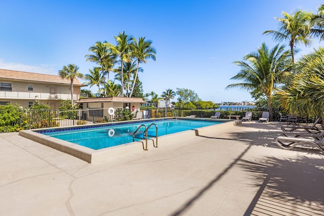 view of swimming pool with a patio