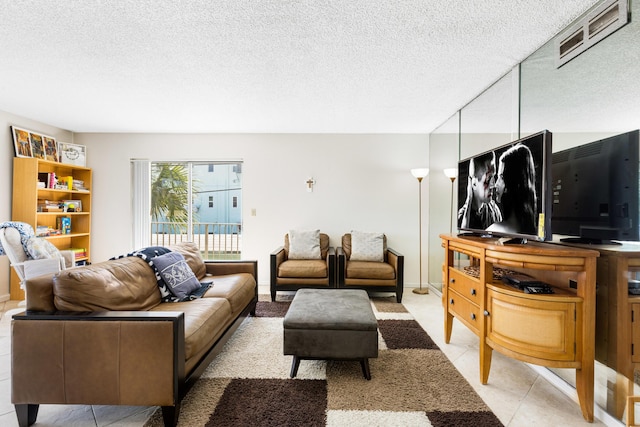 tiled living room with a textured ceiling