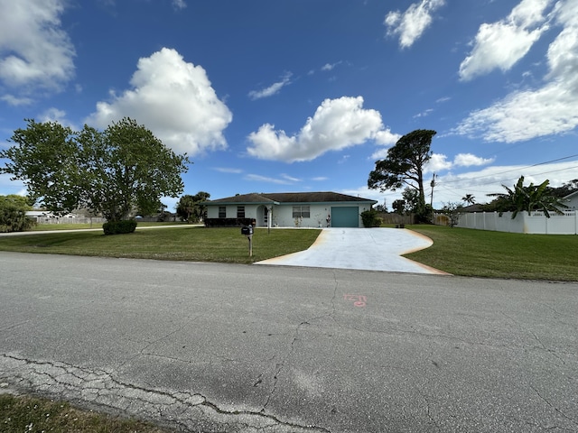 view of front facade featuring a garage and a front yard