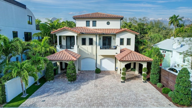 mediterranean / spanish house featuring a balcony