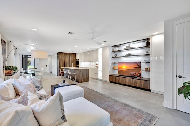 living room with ceiling fan