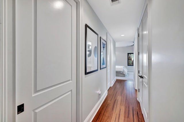 hall featuring dark wood-type flooring