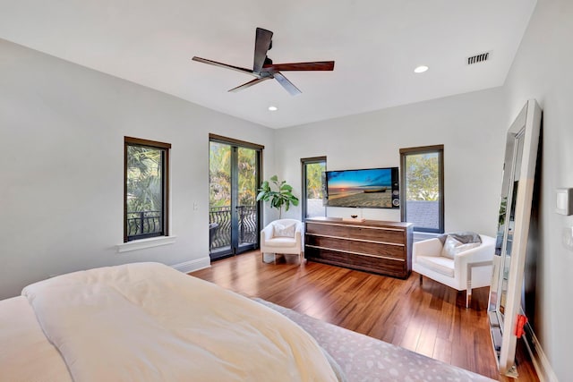 bedroom featuring wood-type flooring, access to exterior, and ceiling fan