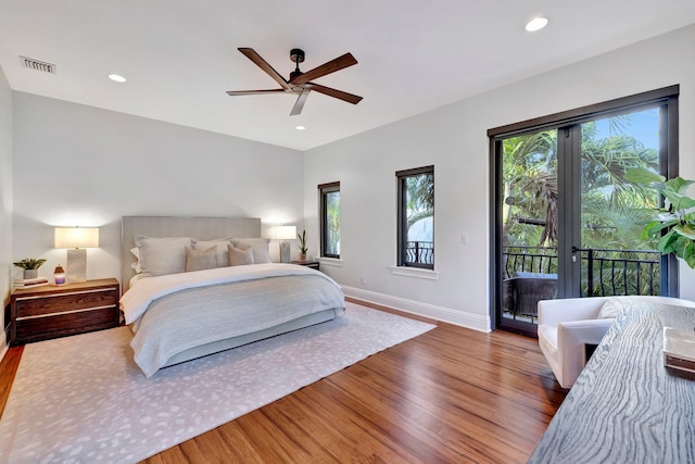 bedroom featuring ceiling fan, hardwood / wood-style floors, and access to outside