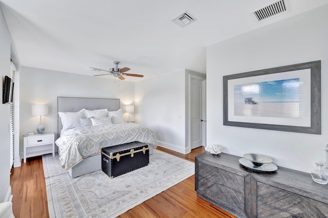 bedroom featuring hardwood / wood-style floors and ceiling fan