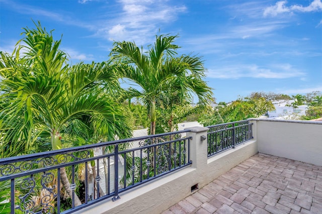 view of patio featuring a balcony