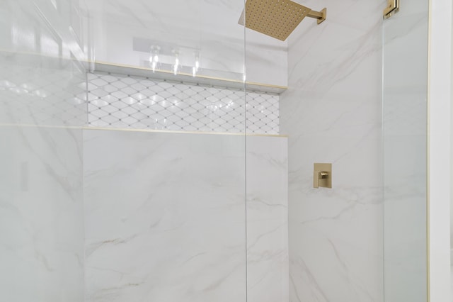 bathroom with a tile shower