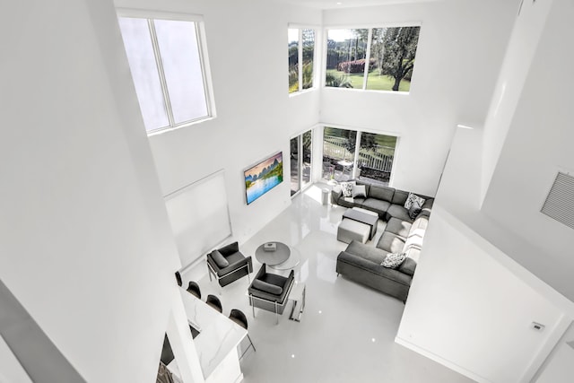 living room with a towering ceiling