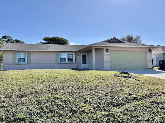 single story home featuring a garage and a front lawn