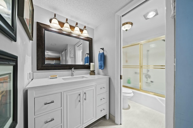 full bathroom with vanity, a textured ceiling, enclosed tub / shower combo, and toilet