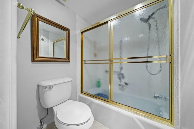 bathroom featuring shower / bath combination with glass door and toilet