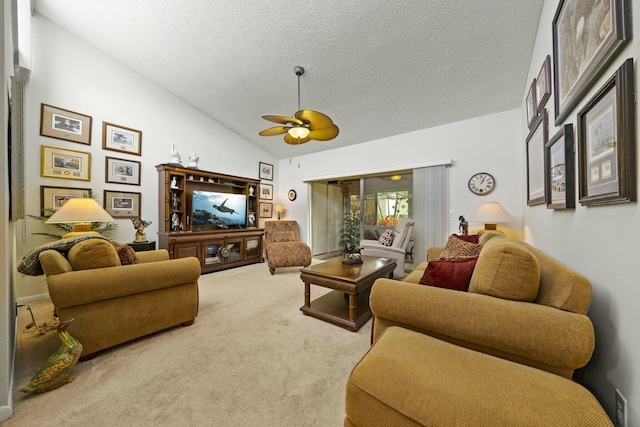 carpeted living room featuring lofted ceiling, ceiling fan, and a textured ceiling