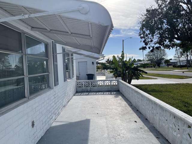 view of home's exterior featuring central AC unit and a lawn