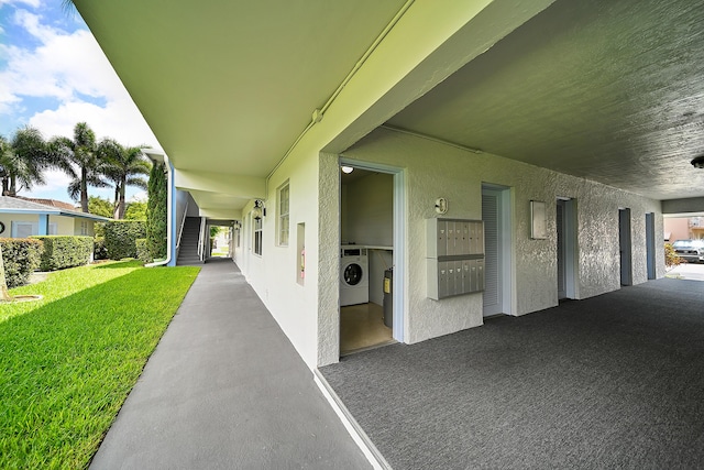 view of patio with washing machine and clothes dryer