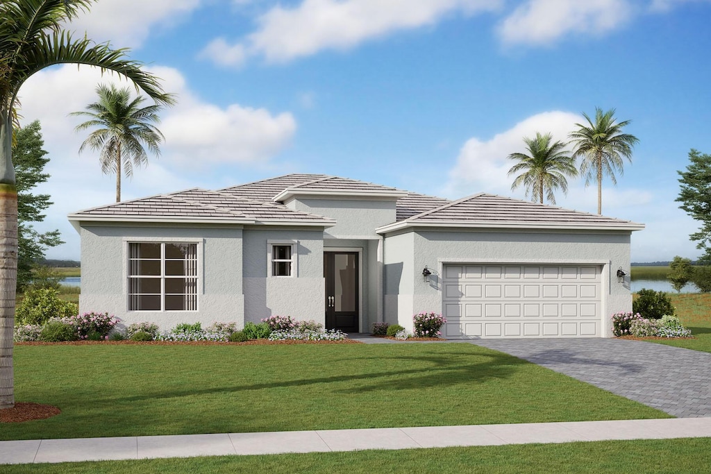 view of front of house featuring a garage and a front yard