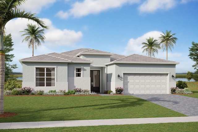 view of front of house featuring a garage and a front yard