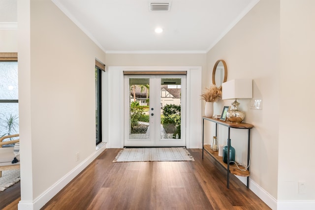 entryway featuring ornamental molding, dark hardwood / wood-style floors, and french doors