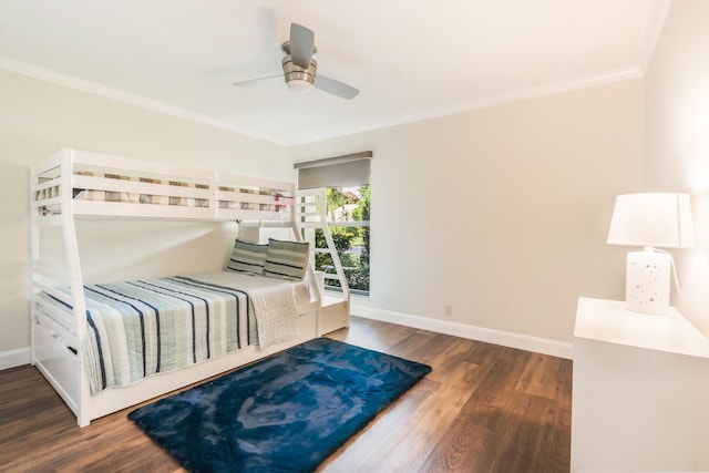 bedroom featuring ornamental molding, dark hardwood / wood-style floors, and ceiling fan