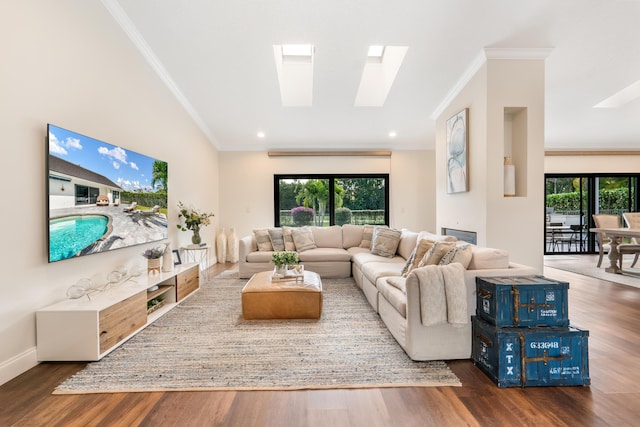 living room featuring dark wood-type flooring, crown molding, and a skylight