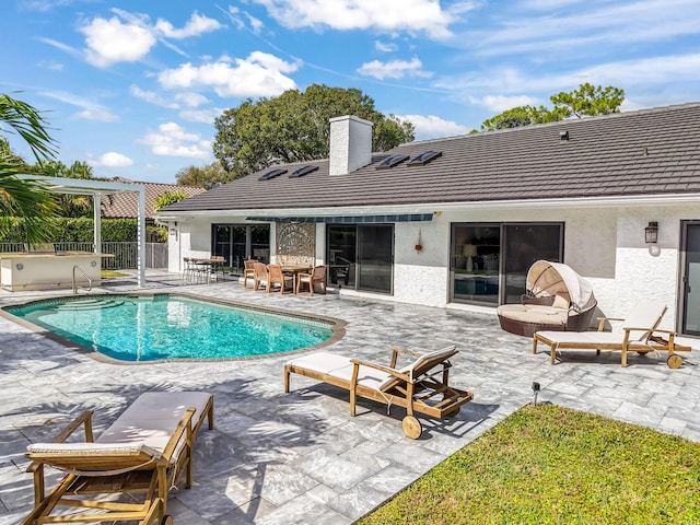 view of pool with a pergola and a patio area