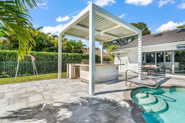 view of patio / terrace featuring a fenced in pool and a bar