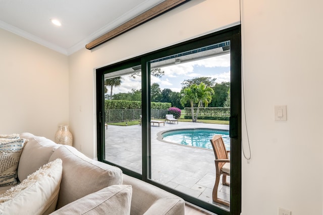 doorway to outside featuring ornamental molding