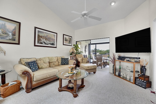 living room featuring ceiling fan, high vaulted ceiling, and carpet