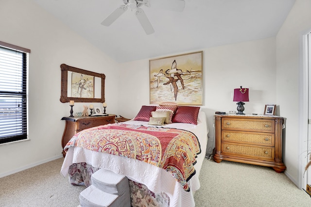 bedroom with lofted ceiling, light colored carpet, and ceiling fan