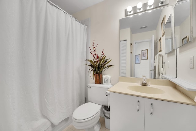 bathroom featuring tile patterned floors, toilet, and vanity