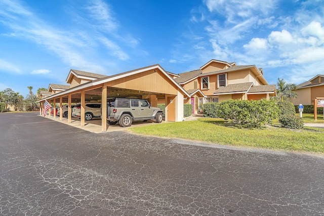 view of front of home featuring a carport