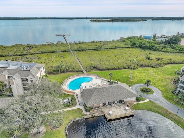 birds eye view of property with a water view