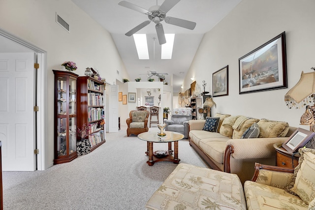 living room with high vaulted ceiling, carpet floors, and ceiling fan