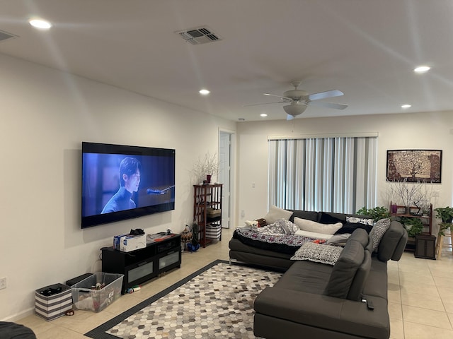 tiled living room with ceiling fan