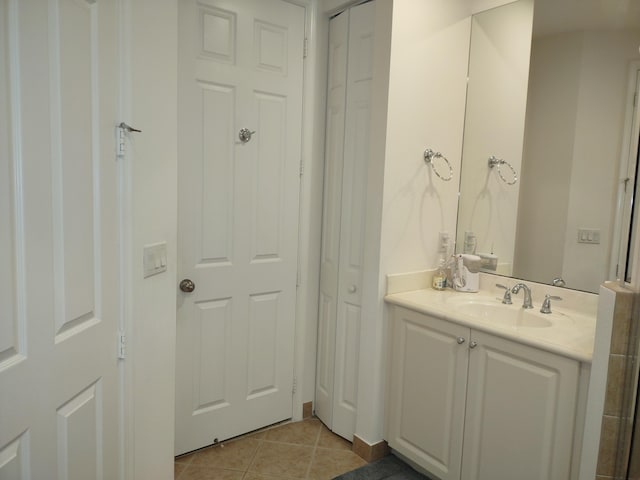 bathroom featuring tile patterned flooring and vanity