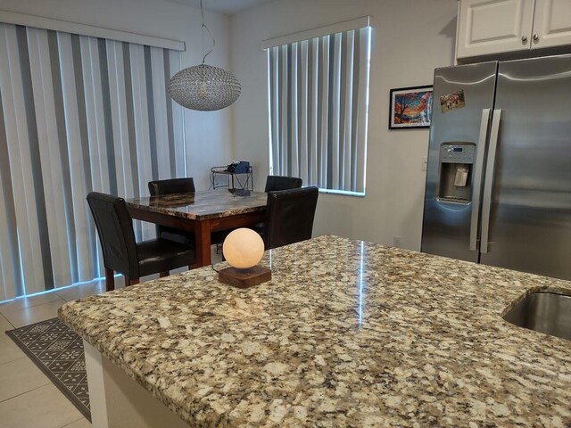 interior space featuring light tile patterned floors