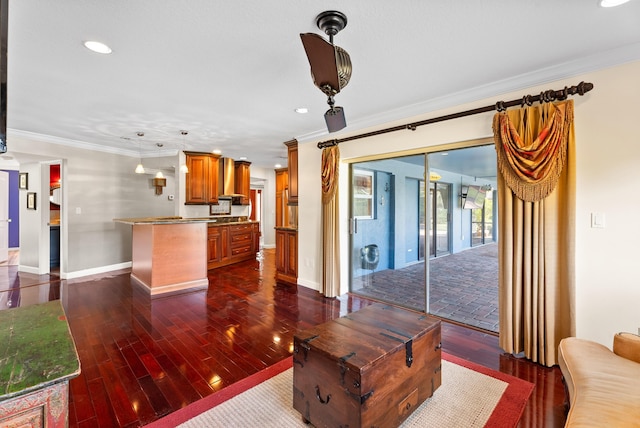 living room featuring ornamental molding and dark hardwood / wood-style floors