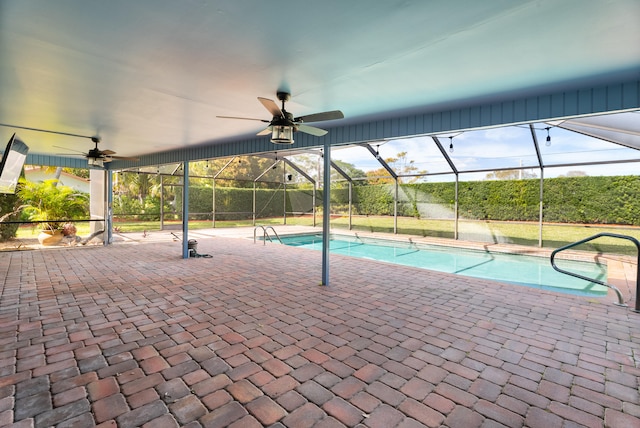 view of pool featuring a patio, a lanai, and ceiling fan