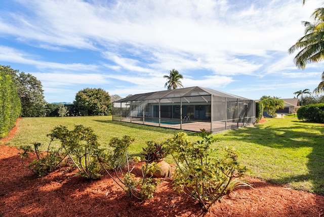 view of yard with a pool and a lanai